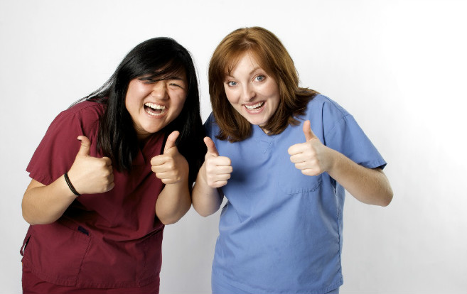asian_nurse_white_nurse_excited_giving_thumbs_up