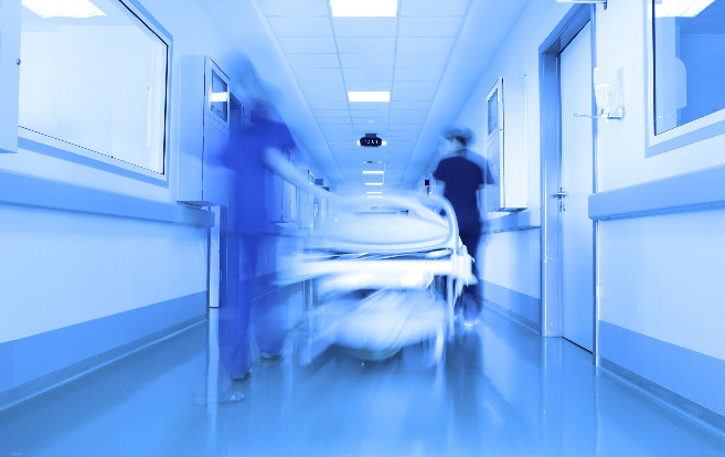 emergency_blurred_gurney_medical_staff_hallway