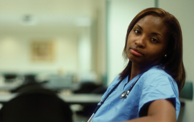 African_American_nurse_looking_at_camera_tired