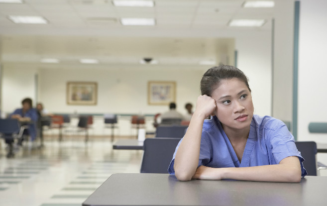 Asian_nurse_cafeteria_tired_stress_worried