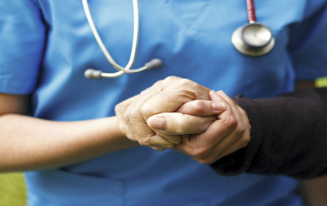 holding_hands_closeup_female_nurse_elderly_patient