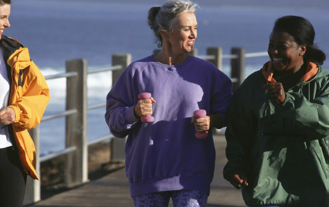 older_women_exercise_walking_together_outside