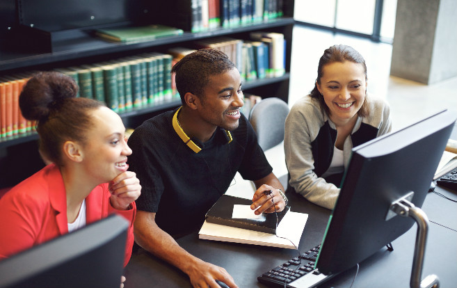 students_working_computer_smiling