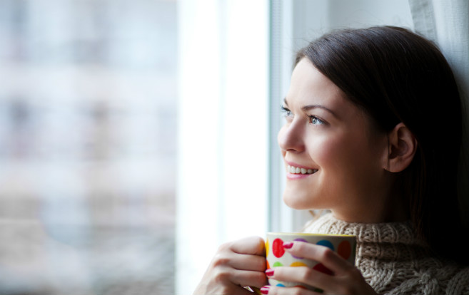 woman_looking_out_window_hot_drink_winter_thinking_choices_dreaming